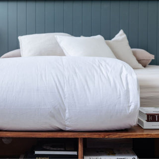 Ultra-Warm Hungarian Goose Down Quilt in white; Cozy winter quilt on a bed.